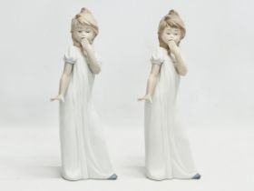 A pair of large NAO ‘Yawning Girl’ figurines. 29.5cm
