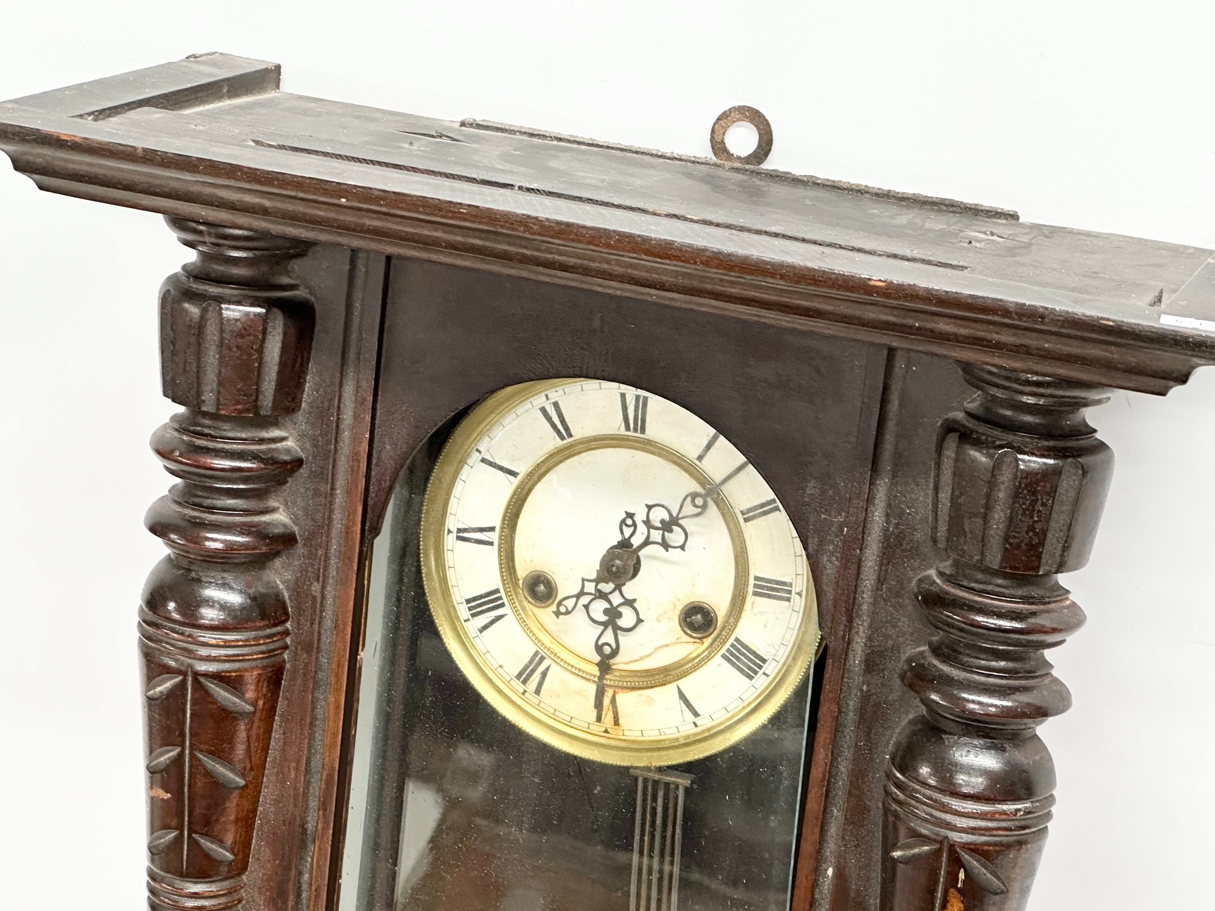 A Late 19th Century Victorian mahogany Vienna wall clock. With key and pendulum. 42x64cm - Image 3 of 5