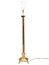 A brass Corinthian style standard lamp. 140cm
