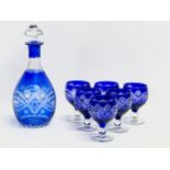 A 7 piece 20th Century Bohemian blue crystal drinks set. Glasses 11cm. Decanter 29cm.