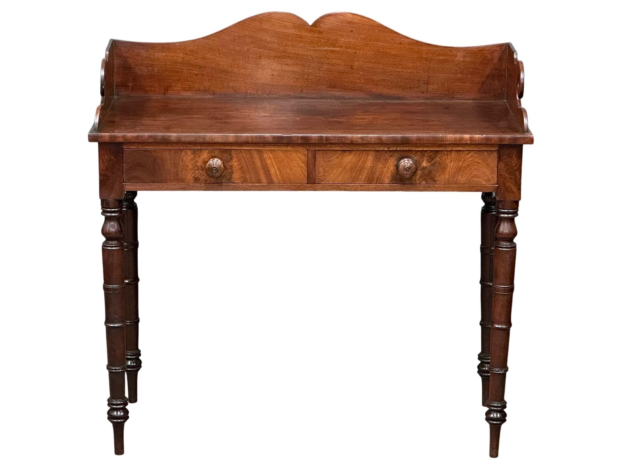 A late George IV mahogany gallery back side table on reeded legs, containing 2 front facing drawers. - Image 5 of 10
