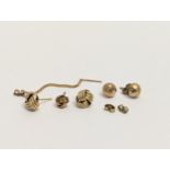 A pair of 9ct gold earrings with 9ct gold backs, and others. Total weight 2.68g