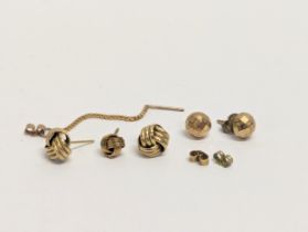 A pair of 9ct gold earrings with 9ct gold backs, and others. Total weight 2.68g