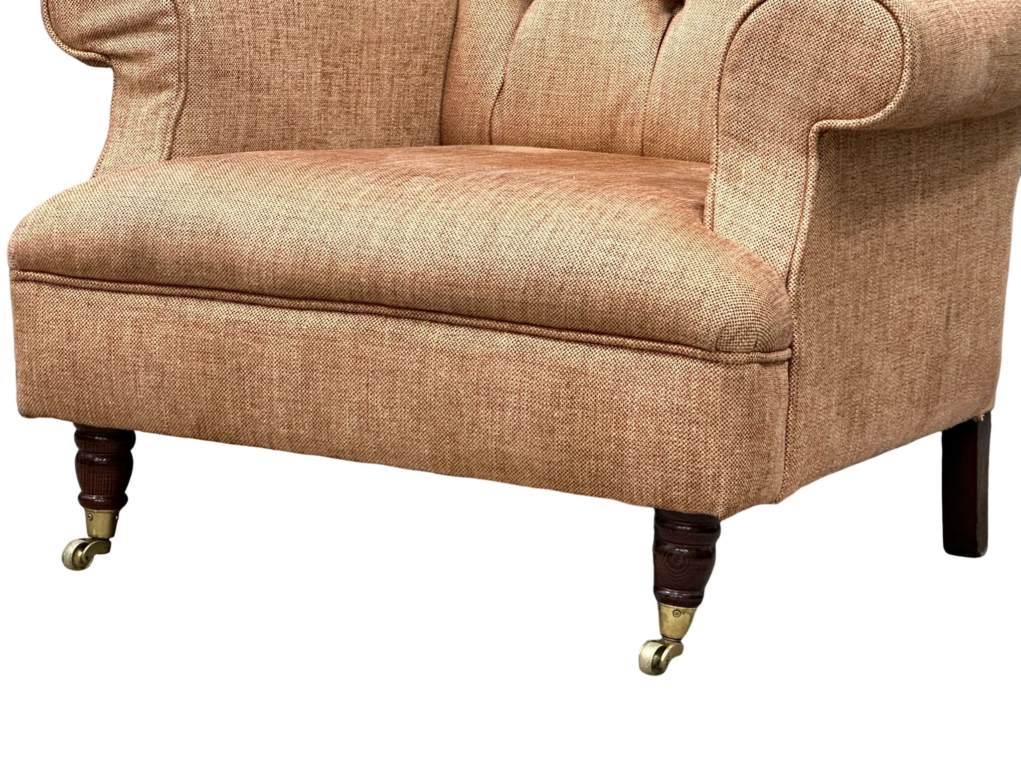 A Late Victorian style button back armchair on brass cup casters. 86x85x90cm - Image 4 of 5