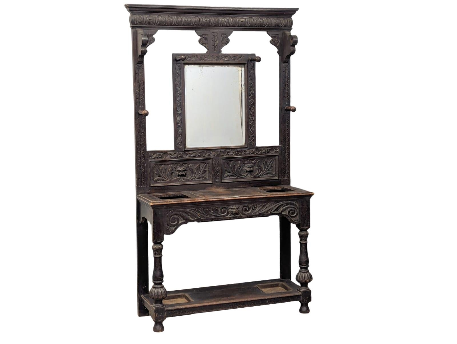 A tall Victorian carved oak hallstand with Man Of The Forest carved decoration, circa 1870-80, 107cm