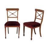 A pair of Edwardian inlaid mahogany side chairs on square tapering legs. In the Sheraton style.