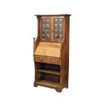 A late 19th Century oak Arts & Crafts bureau bookcase, in the manner of Liberty. Circa 1880-1890s.