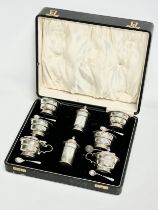 A large silver condiment set in case. Birmingham 1932. Without liners 328.25 grams. 28x23x8cm