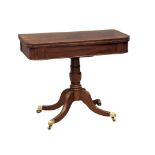 A late George III mahogany turnover games table on brass cup casters. 90.5x44.5x74.5cm