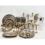 A collection of silver plate. 3 sets of chalices, salvors, silver plated rooster, claret jug etc