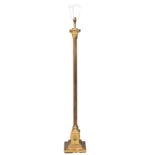 A vintage brass standard lamp with a reeded and Corinthian style column. 138cm