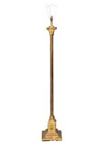 A vintage brass standard lamp with a reeded and Corinthian style column. 138cm