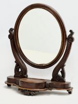 A Victorian mahogany dressing mirror.