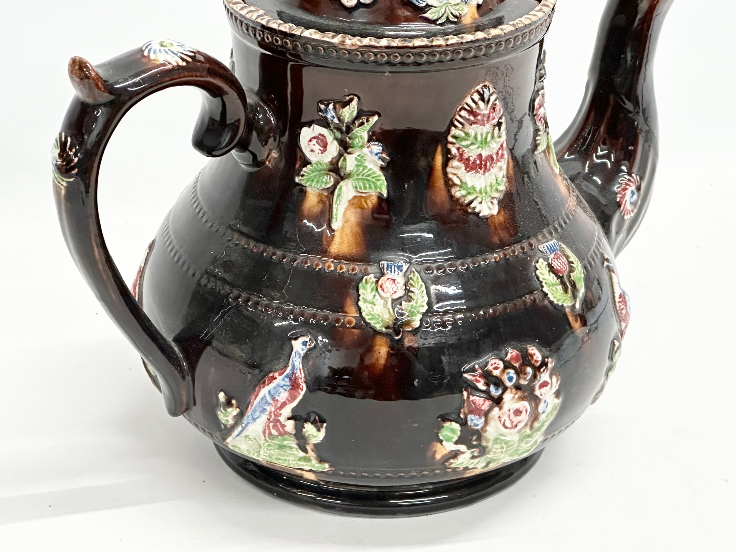 A large Late 19th Century Measham Pottery ‘Bargeware’ teapot. Circa 1880-1890. Forget Me Not. - Image 5 of 8