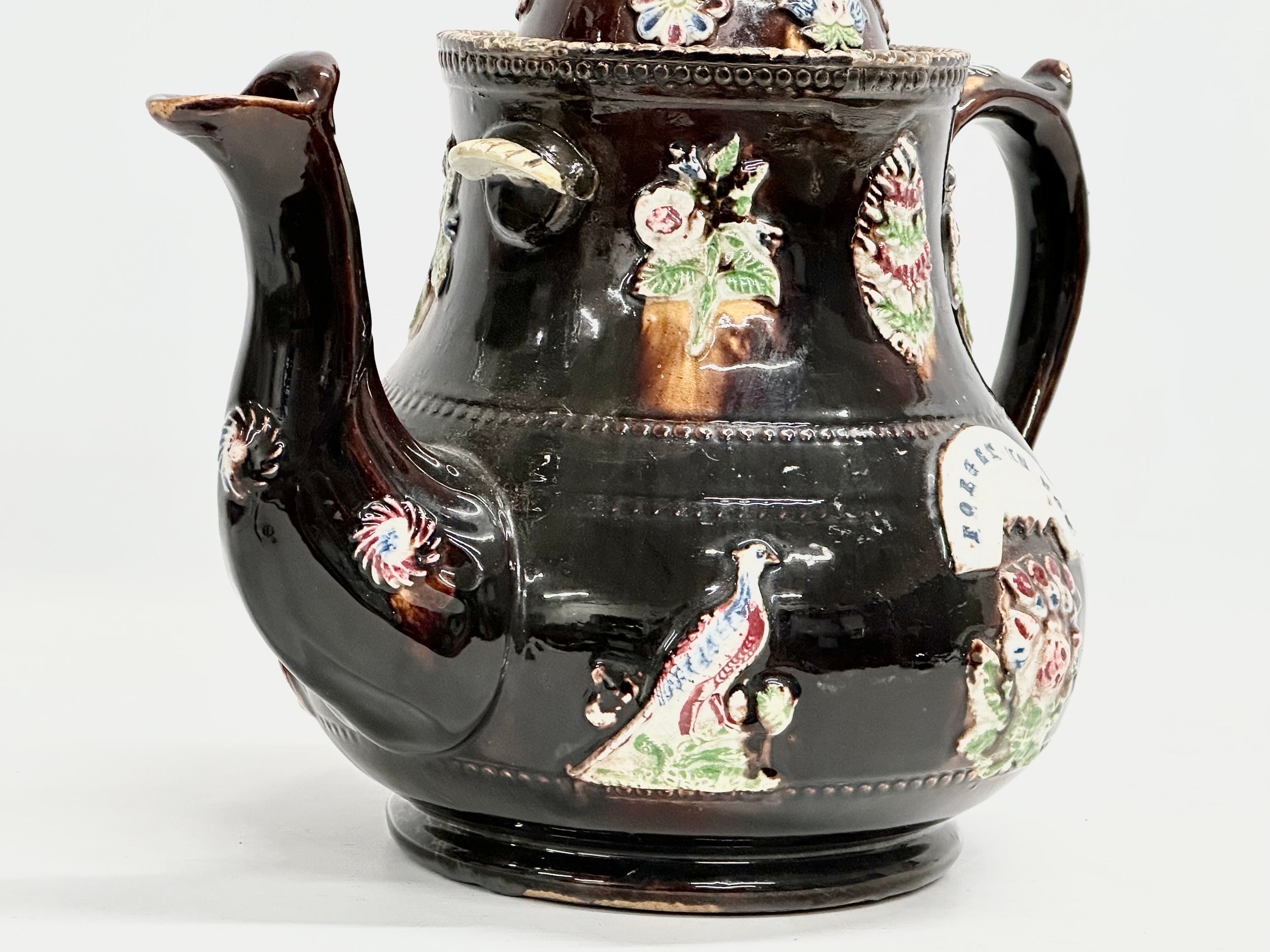 A large Late 19th Century Measham Pottery ‘Bargeware’ teapot. Circa 1880-1890. Forget Me Not. - Image 2 of 8