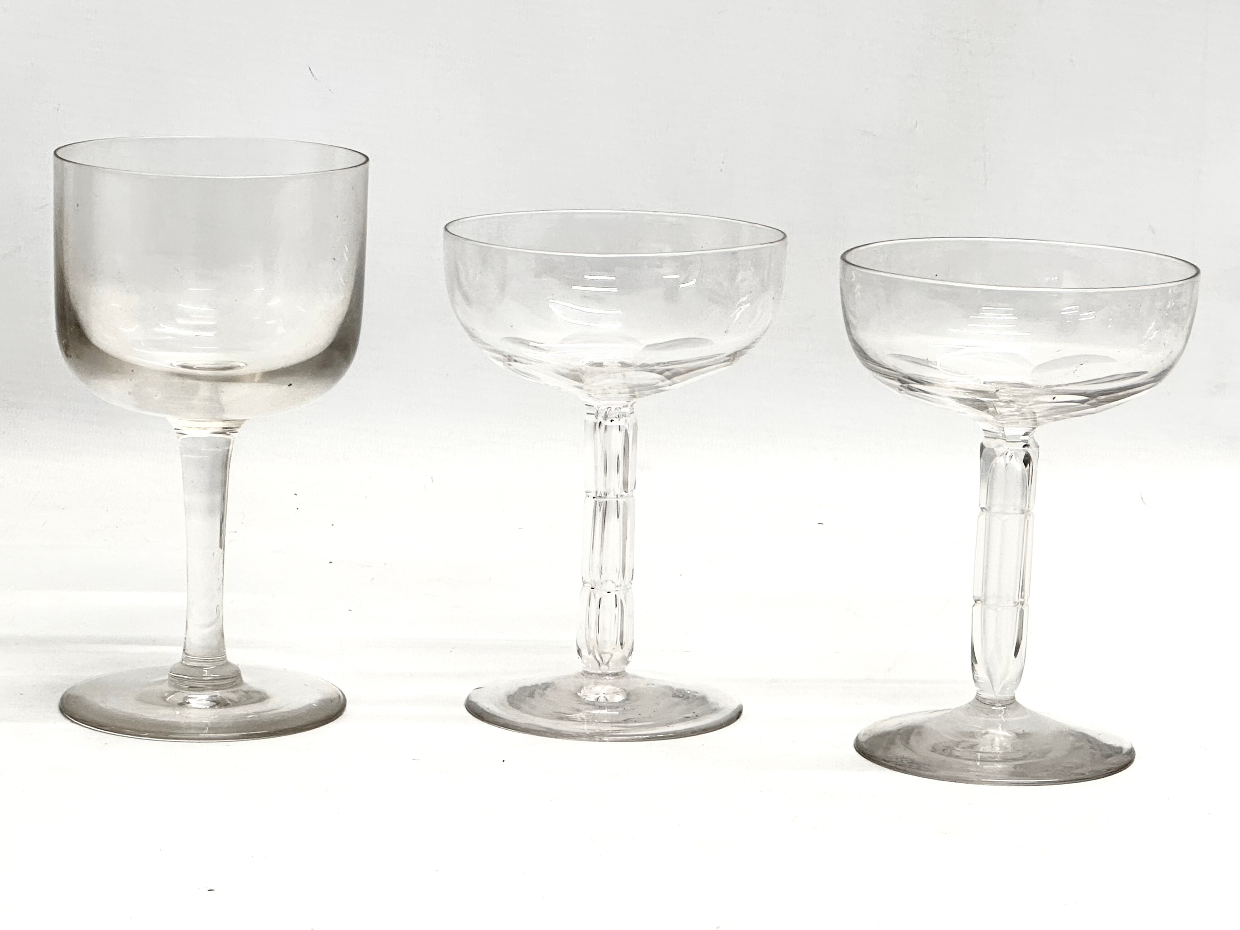 Victorian champagne and wine glasses. A pair of Late 19th Century Victorian slice lens cut champagne