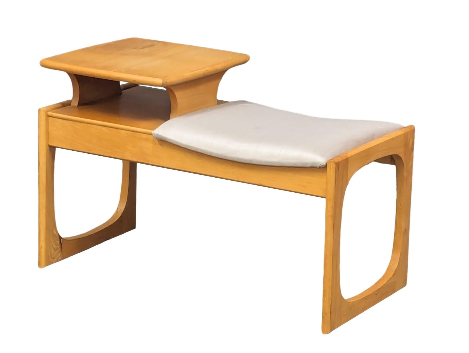 A Mid Century beech telephone table by Chippy. 74x36.5x47cm