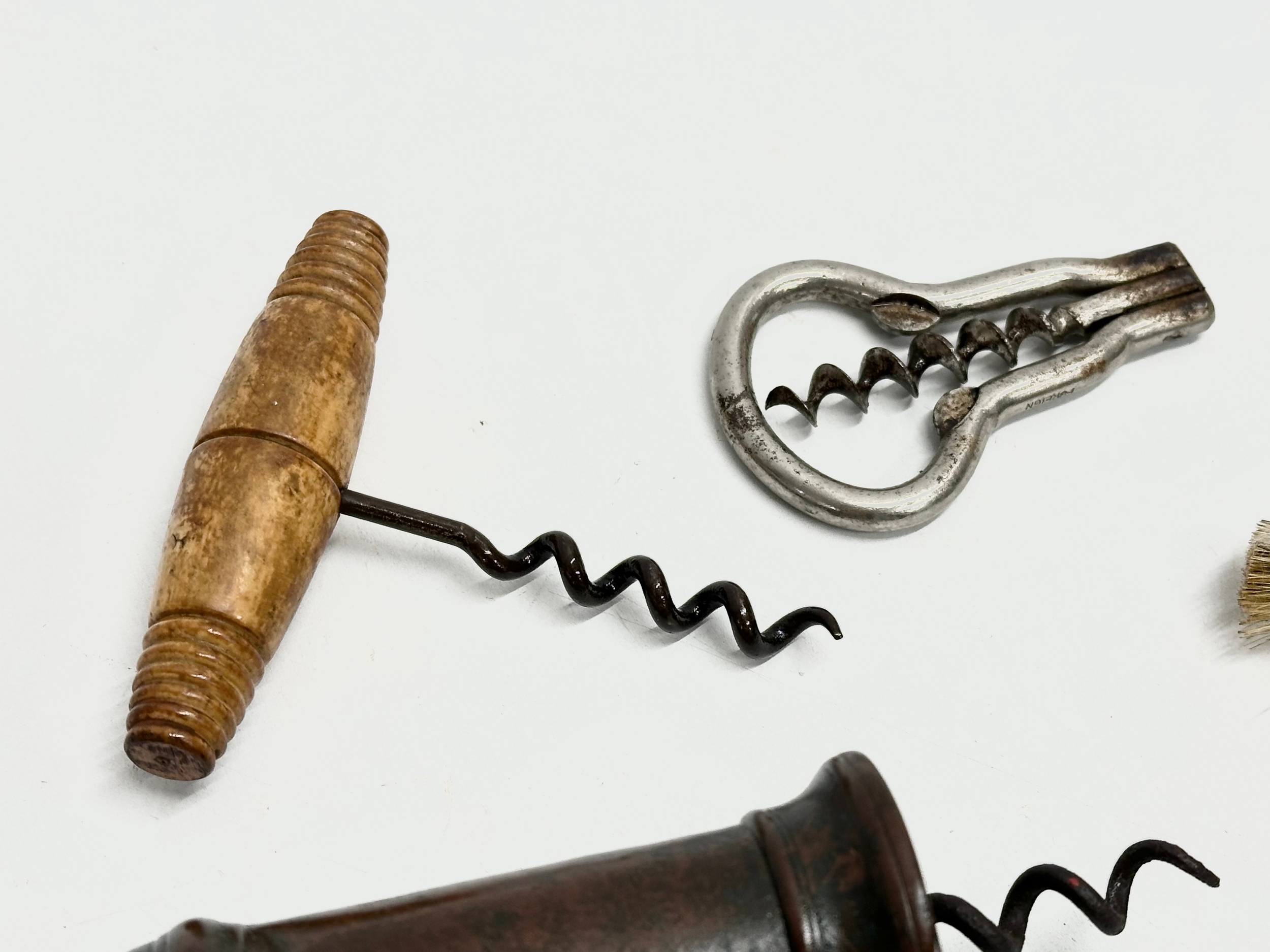 A good collection of 19th Century corkscrews with turned handles. A large barrel shaped corkscrew - Image 5 of 9