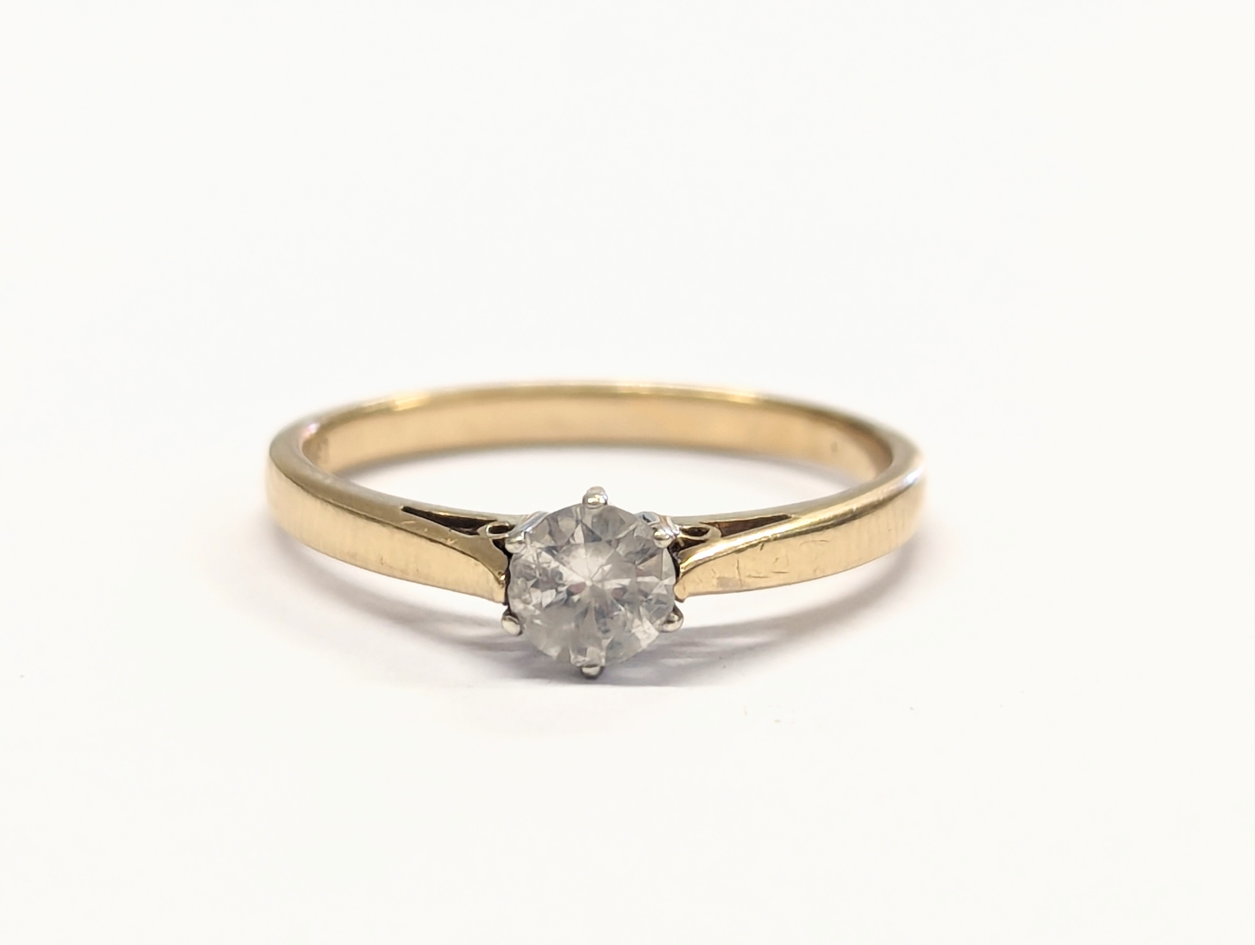 A 9ct gold and diamond ring. 1.8g. Size UK N.