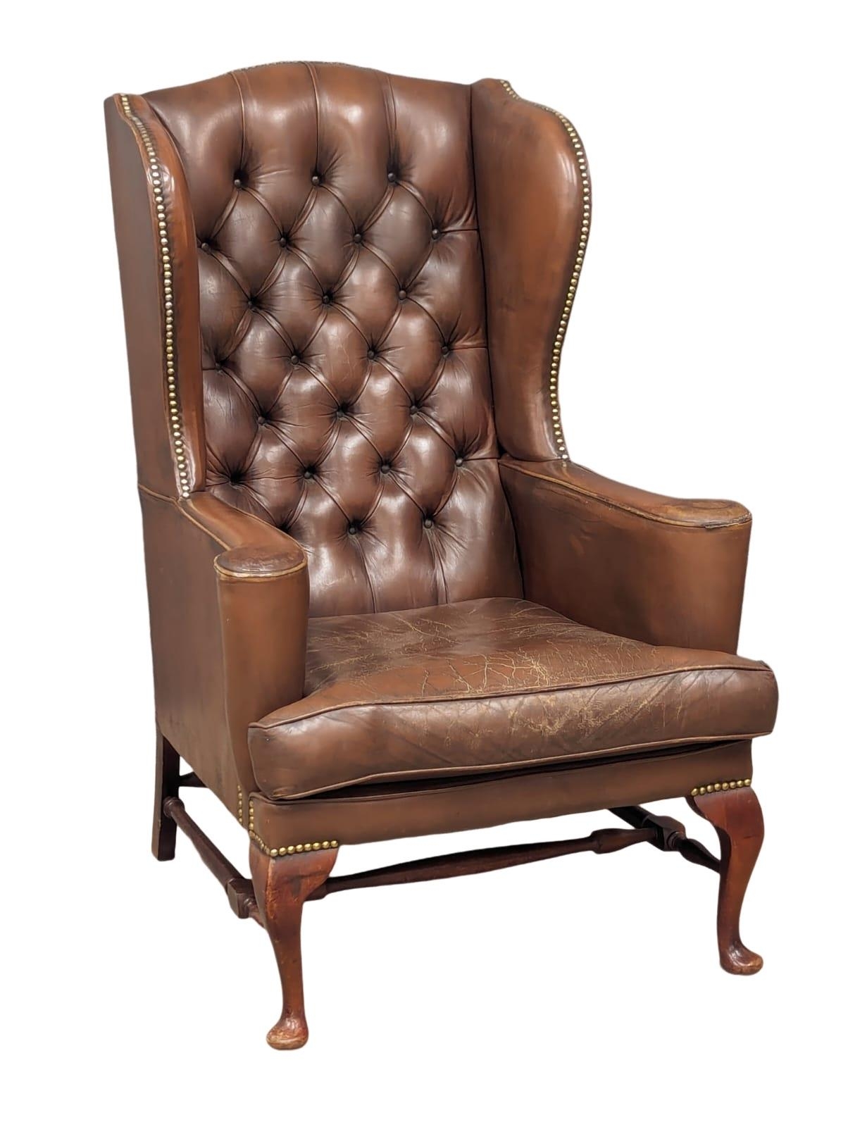 A brown deep button back leather wingback armchair in the early Georgian style - Image 3 of 6