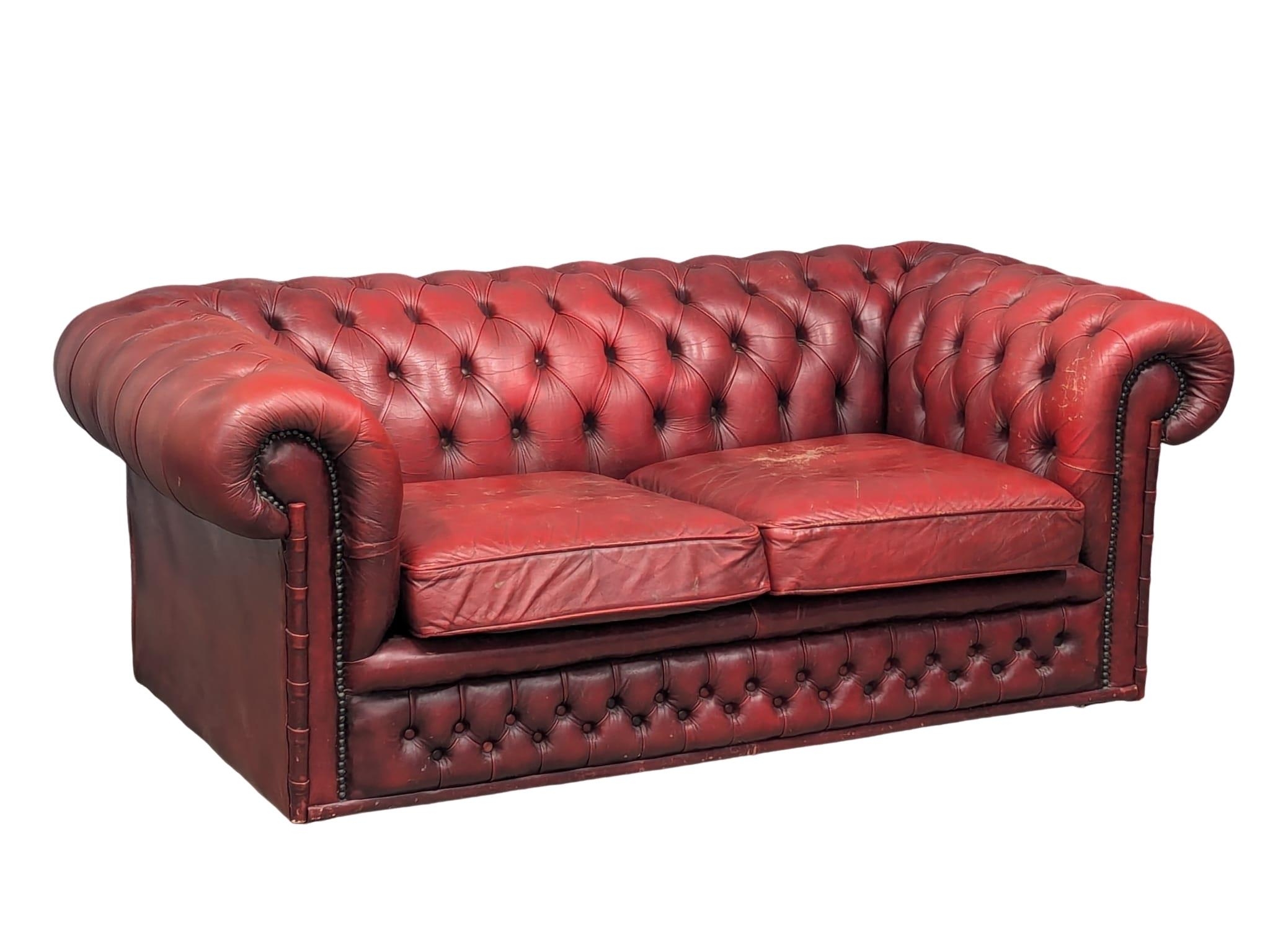 A 2 seater Chesterfield style button back sofa, 169cm