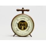 A Late 19th/Early 20th Century French brass cased barometer. Made in Paris. Circa 1900. 8x5x9.5cm