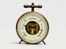 A Late 19th/Early 20th Century French brass cased barometer. Made in Paris. Circa 1900. 8x5x9.5cm