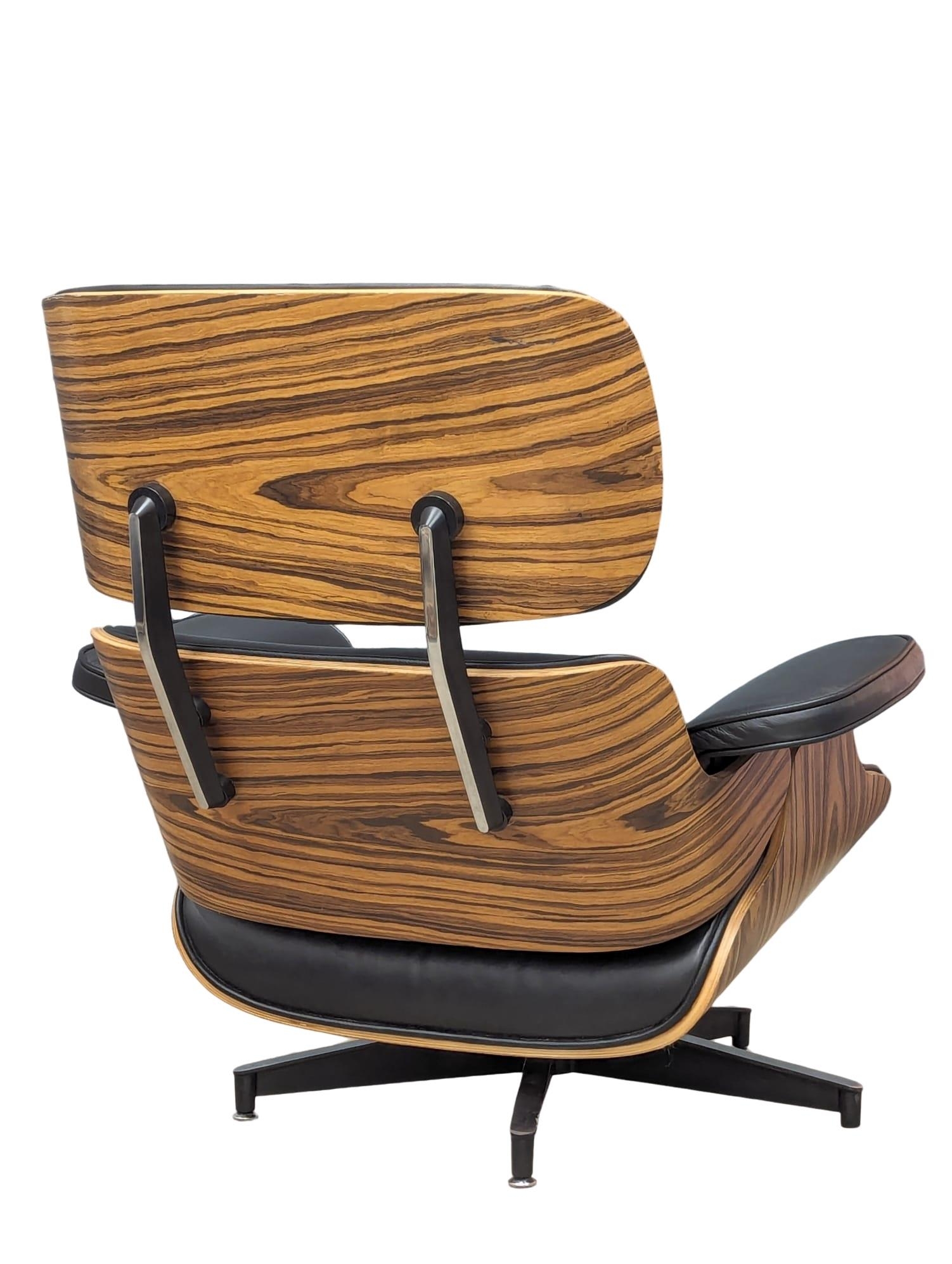 A Charles & Ray Eames Style swivel chair and ottoman. - Image 6 of 8