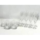 A set of 8 crystal champagne glasses with 5 matching whiskey glasses. 22cm.