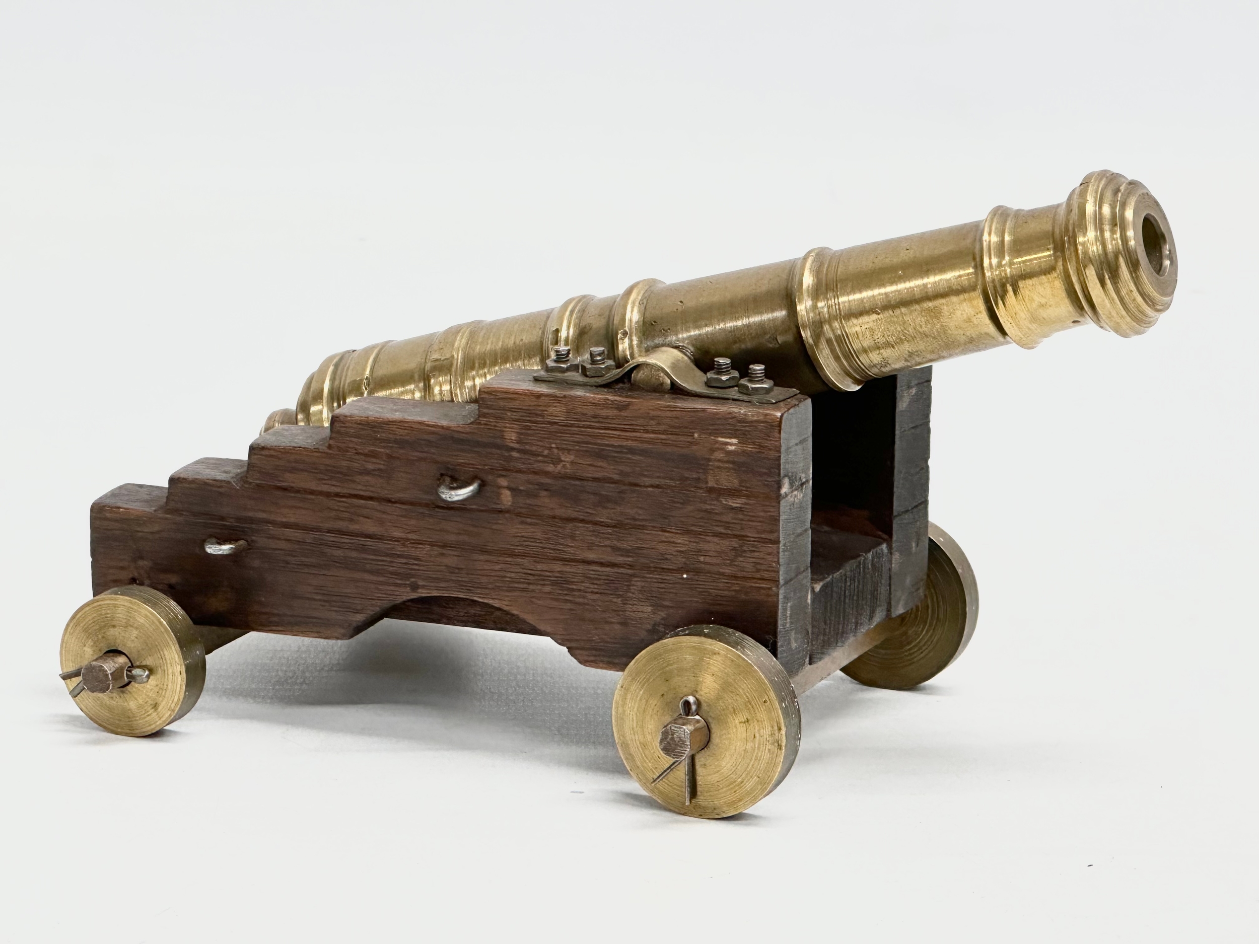 A good quality Early 20th Century brass naval cannon on wooden stand. 17cm - Image 3 of 3