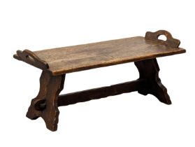 An early 20th century oak bench, 97cm x 44cm x 43cm