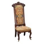 A mid 19th Century carved mahogany Prie Dieu chair with barley twist supports and cabriole legs
