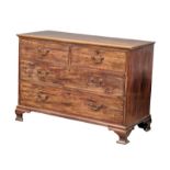 A George III mahogany oak lined chest of drawers on ogee feet and original brass drop handles. Circa