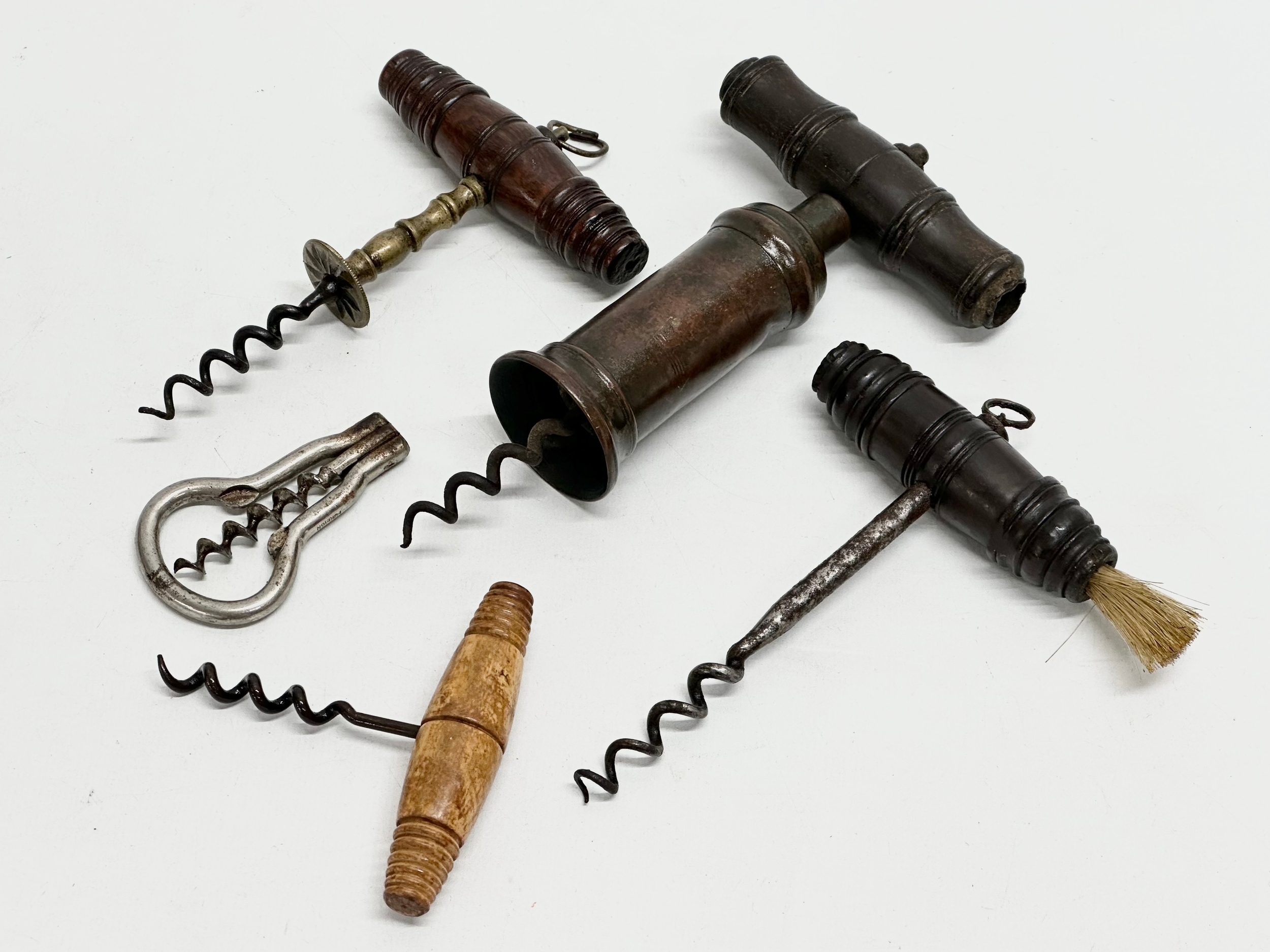 A good collection of 19th Century corkscrews with turned handles. A large barrel shaped corkscrew - Image 9 of 9