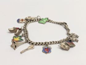 A silver cham bracelet with silver charms. Herbert Bushell & Son Ltd, Birmingham. Total weight 29.