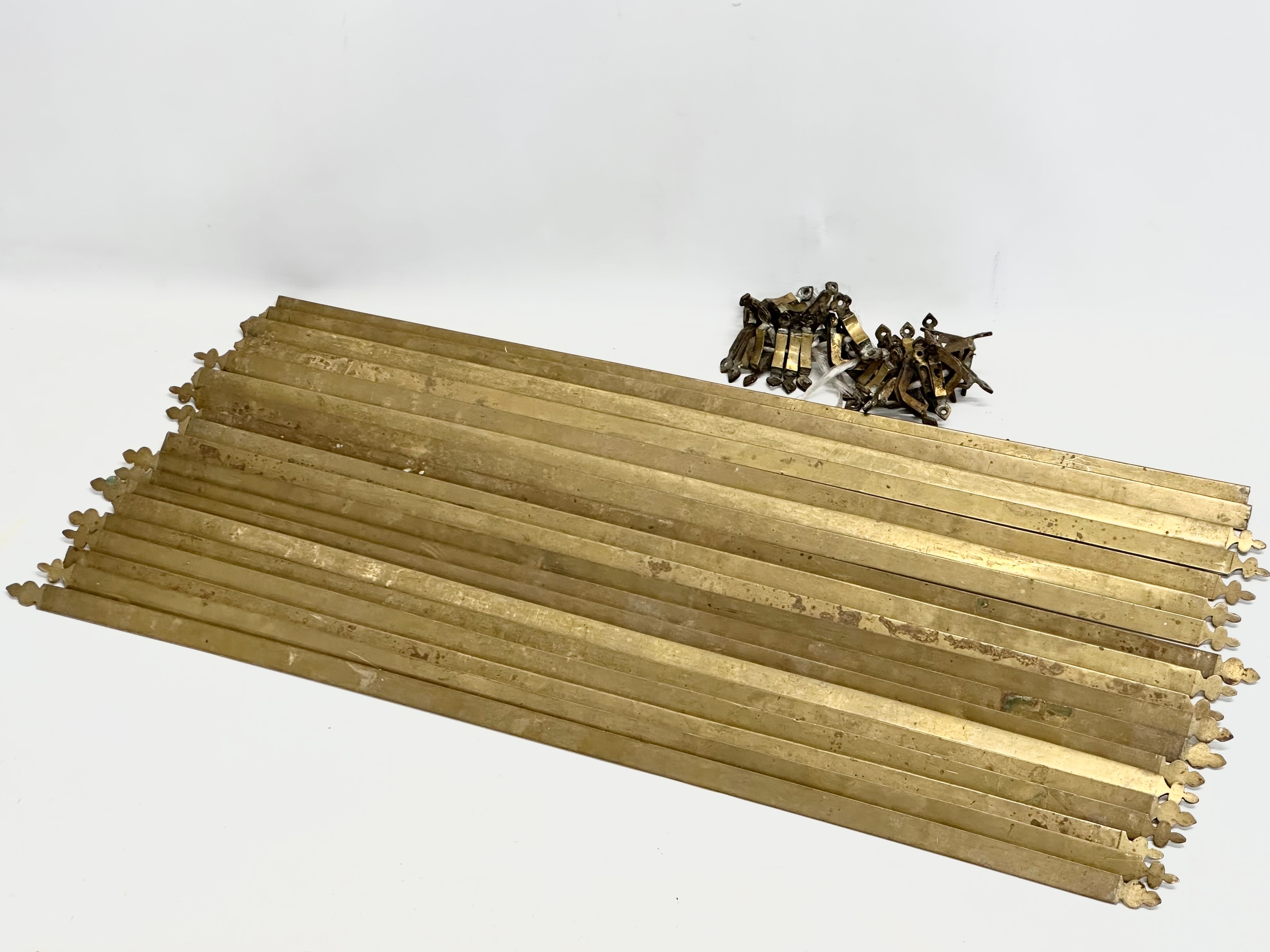 A quantity of Late 19th/Early 20th Century brass stair rods. 81cm