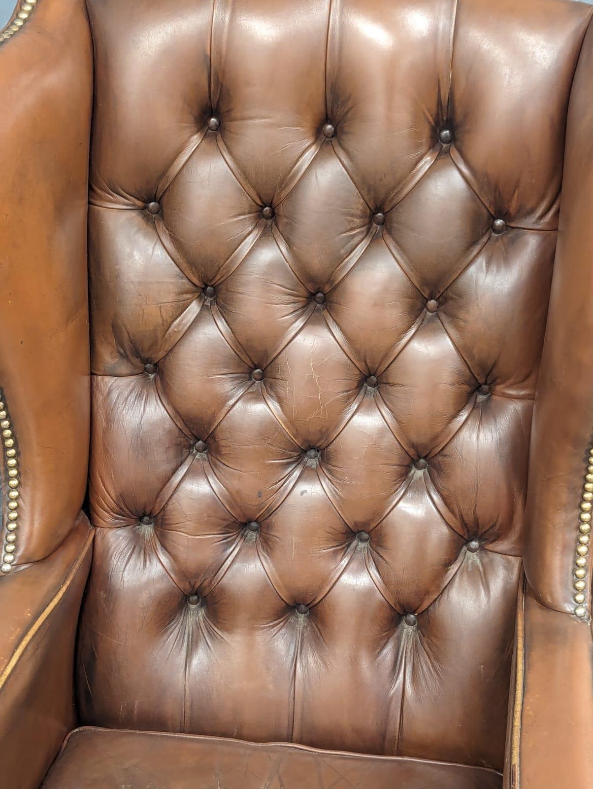 A brown deep button back leather wingback armchair in the early Georgian style - Image 5 of 6