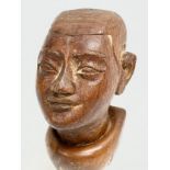 A 19th Century Burmese teak bust wall plaque. 18cm