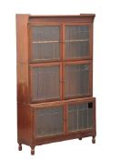 An Early 20th Century mahogany stacking bookcase with astragal glazed doors by Minty. 89x30x150cm