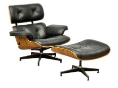 A Charles & Ray Eames style leather swivel armchair and ottoman.