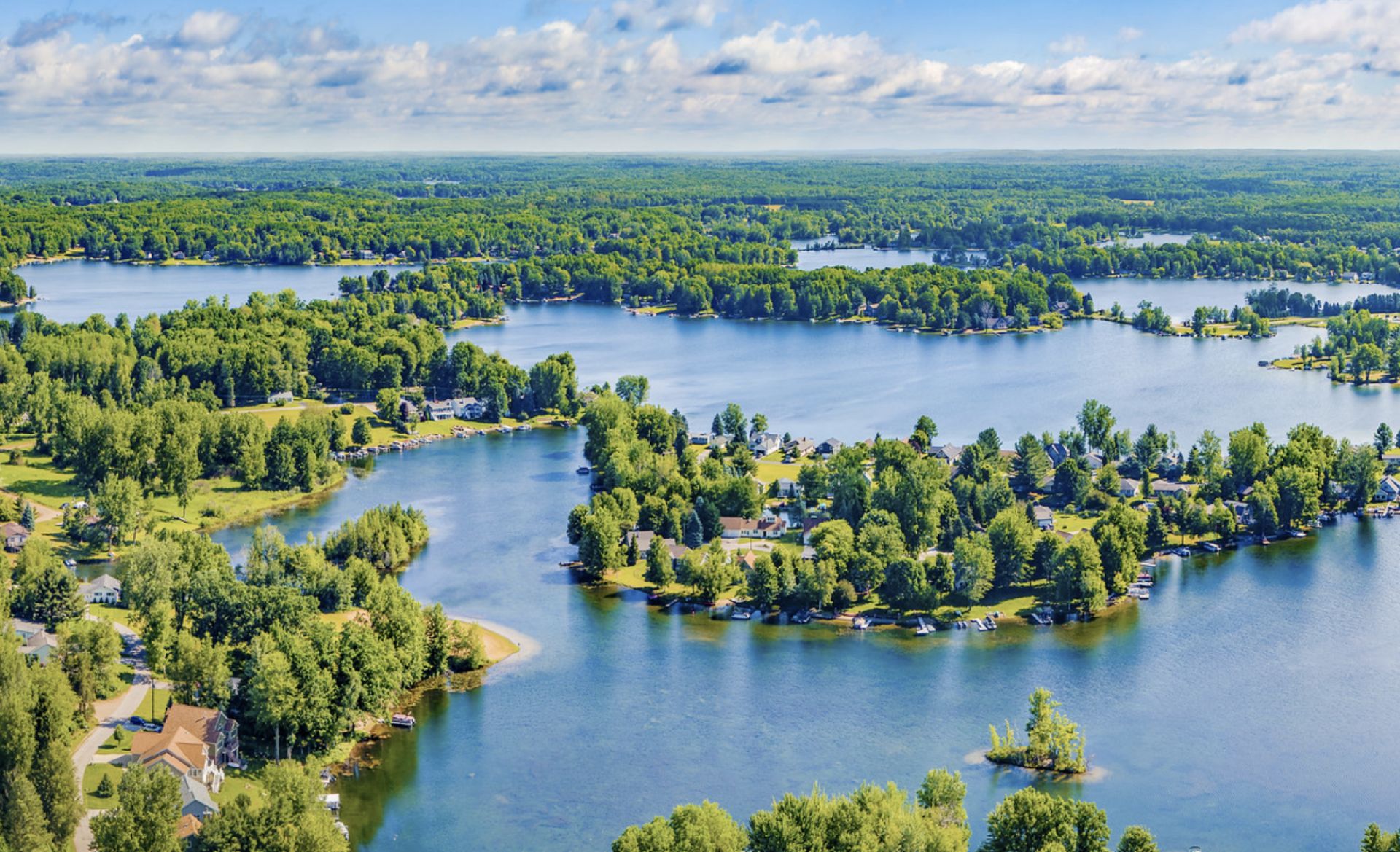 Experience the Best Resort Lifestyle: Great Homesite in Canadian Lakes, Michigan!