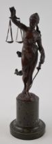 A bronze figurine of Justice on marble base. Height 27cm. In good original condition.