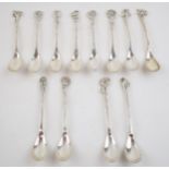 A cased set of continental silver spoons with floral decoration to handles. (12) 130 grams. In