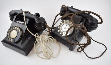 A pair of vintage black Bakelite telephones with wires (2). Sold as decorative though untested.