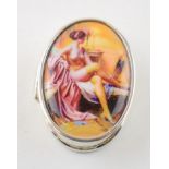 Sterling silver pill box with enamelled insert of a semi-erotic scene, 19.3 grams, 4cm long.