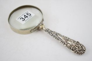 Edwardian silver magnifying glass with ornate handle, Birmingham 1902, 19cm long.