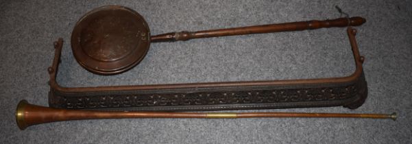 A 19th century steel fire fender with a copper and brass hunting post horn with a Victorian copper