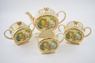 Sadler tea ware in a floral gilt pattern with a cottage scene to include a teapot, 2 lidded sugars