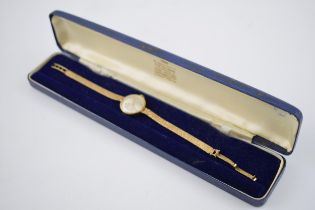 9ct gold ladies Garrard wristwatch on 9ct gold strap, cased, gross weight 15.9 grams, in working