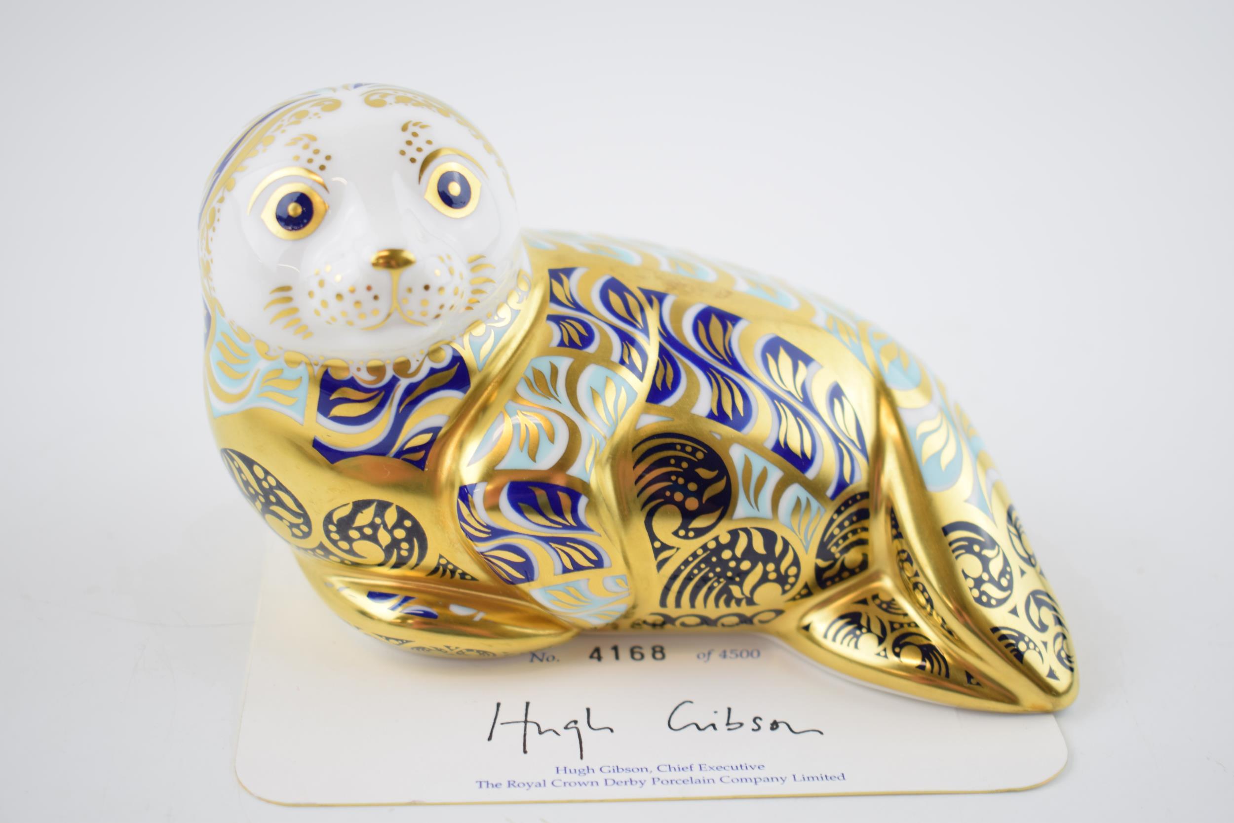 Royal Crown Derby paperweight of a limited edition Harbour Seal, with certifcate and gold stopper.